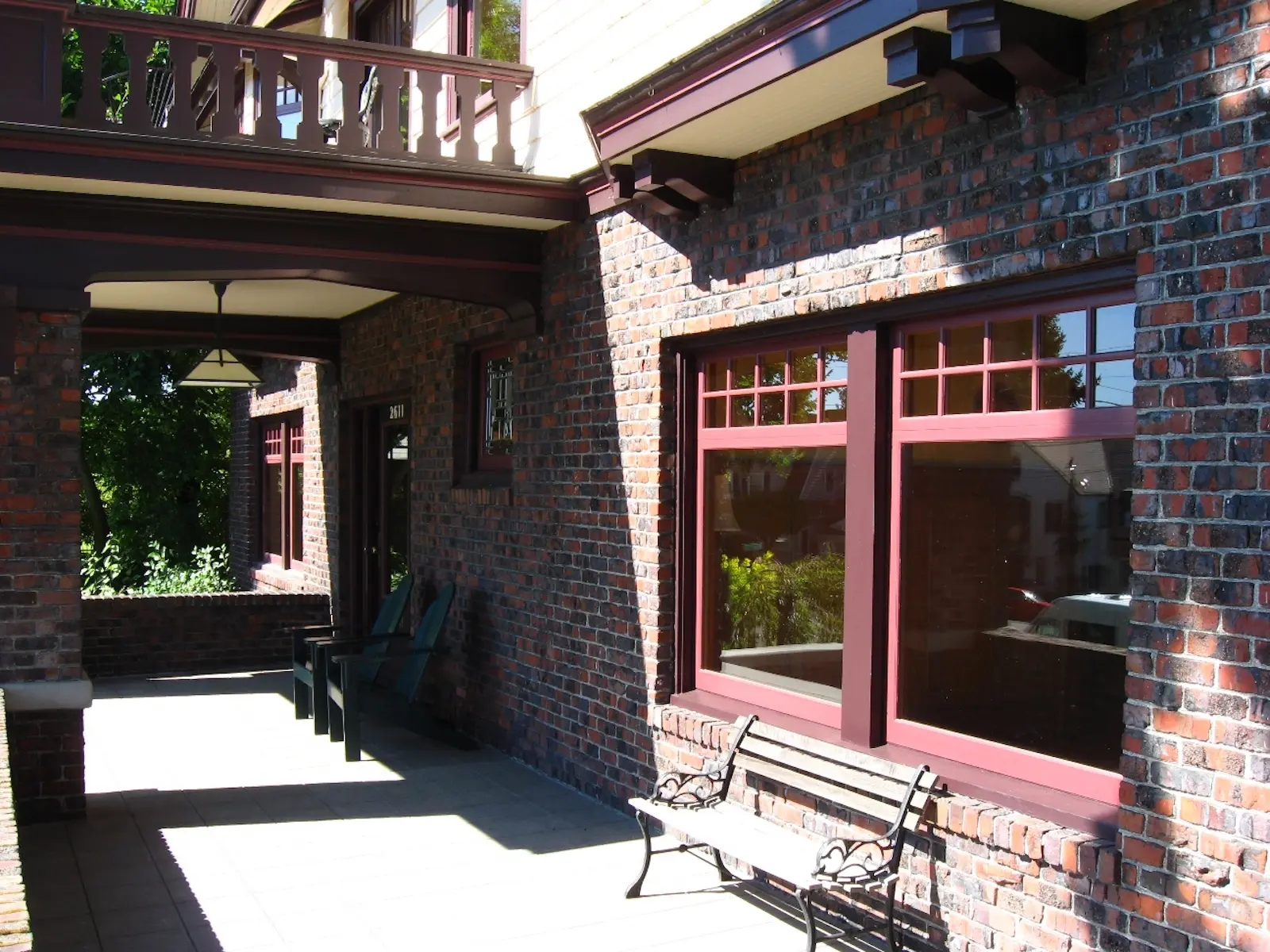 Red-trimmed bay windows on the 1914 Craftsman home