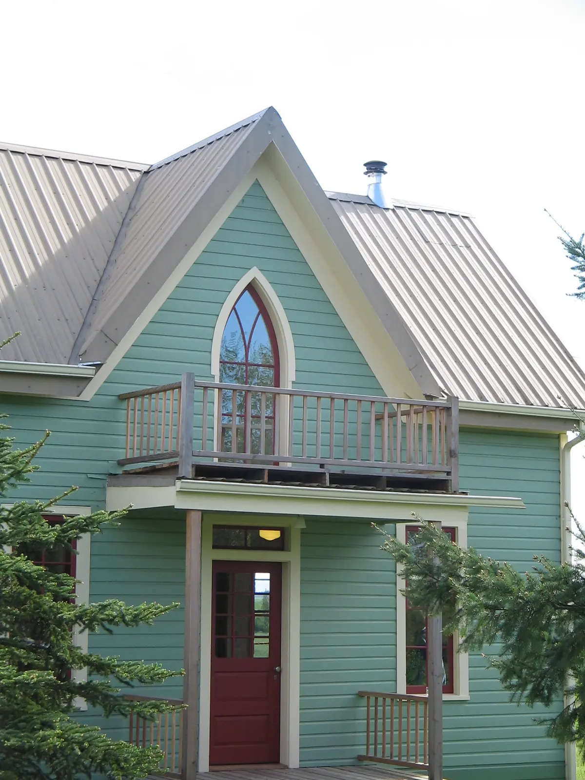 Pointed-arch custom window on the Craftsman home
