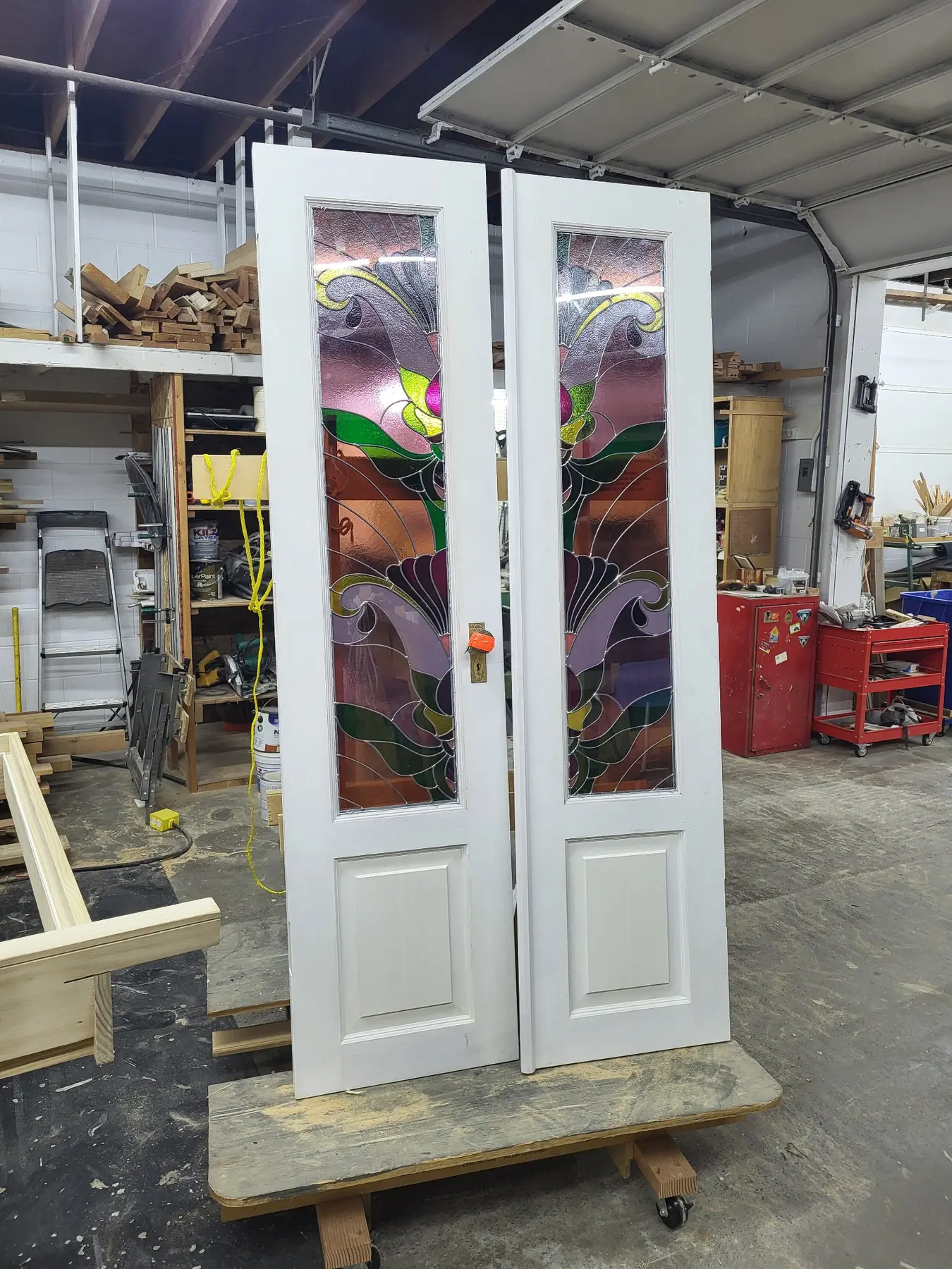Painted custom double doors with decorative stained glass