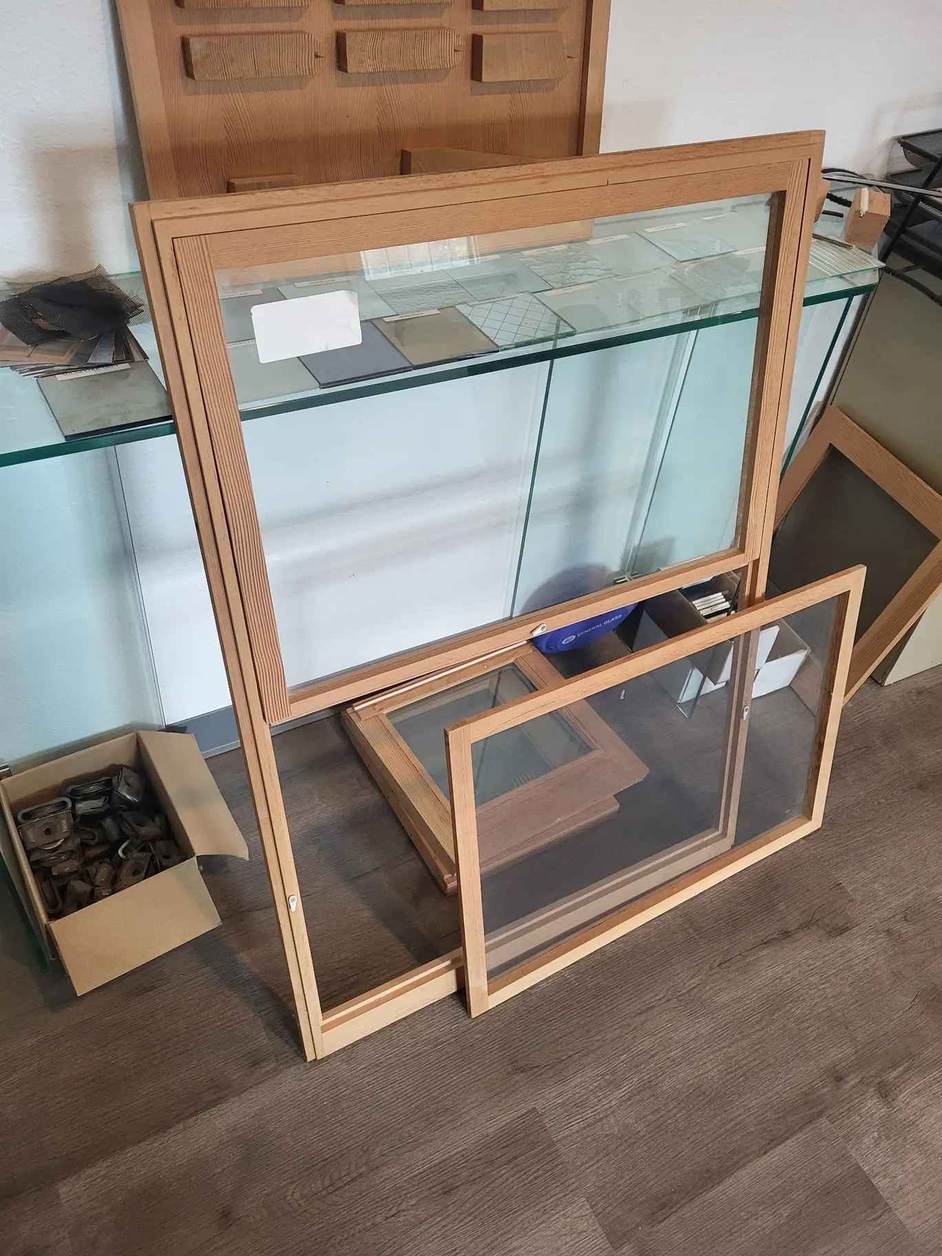 Wood storm-screen combination with glass and screen panels in the Wooddale shop